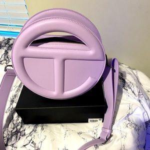Telfar circle bag in lavender.